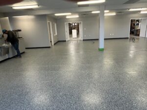 A surface being treated with a protective coating in an industrial setting.