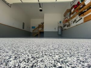 Hermetic Coatings team applying garage floor coating